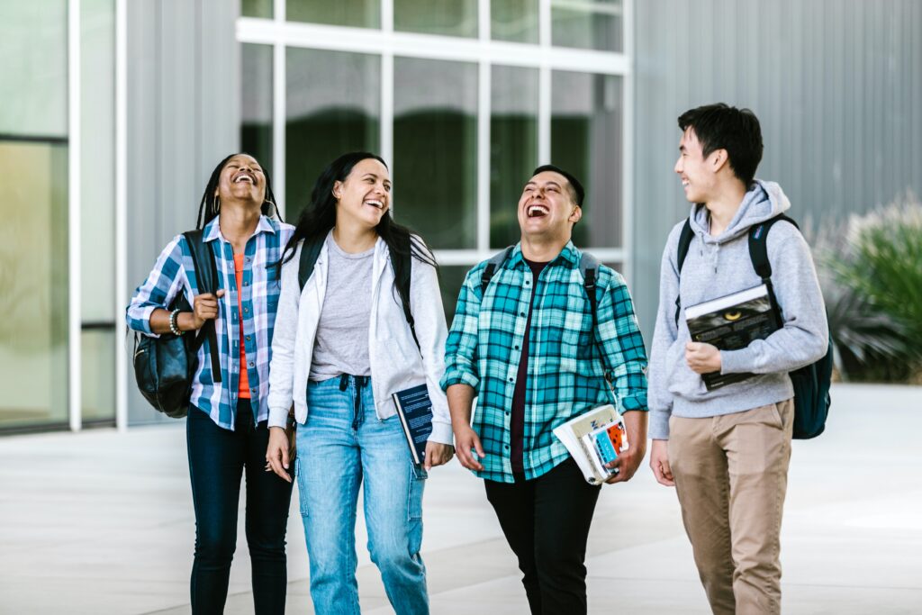 students taking their chosen types of college degrees while walking in a university 