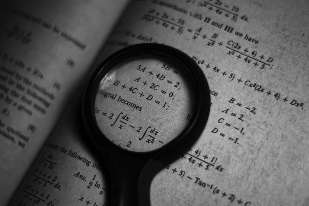 magnifying glass highlighting mathematics equations