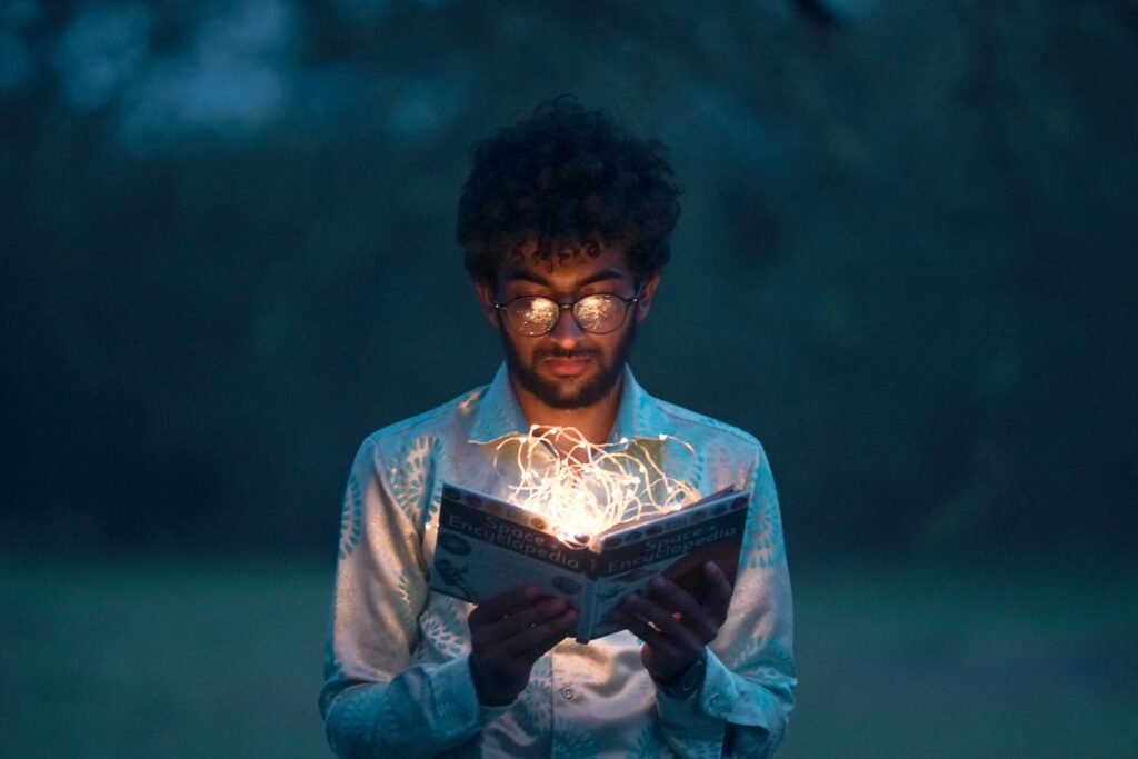 Man Holding Book signifying epistemology degree through knowledge