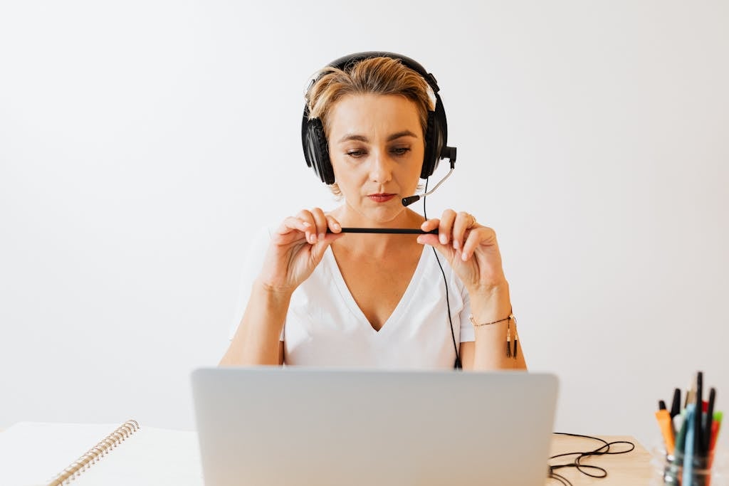 Woman with Headphones Working Remotely