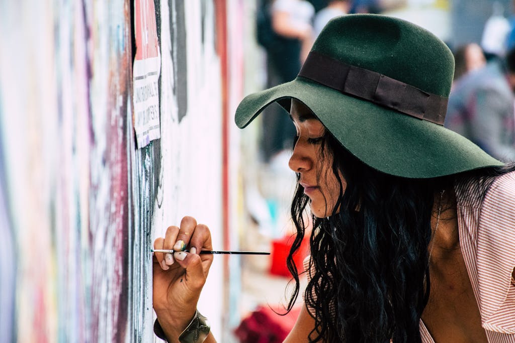 Woman Painting on a Wall